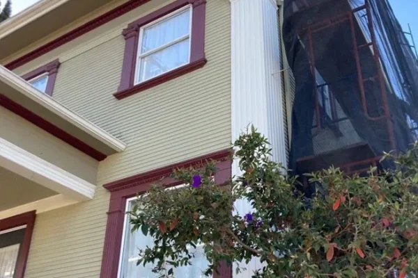 Protective scaffold system by Modesto Scaffolding Rental for home restoration