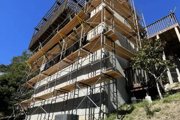 Multi-level frame scaffolding setup by Modesto Scaffolding Rental for residential work.