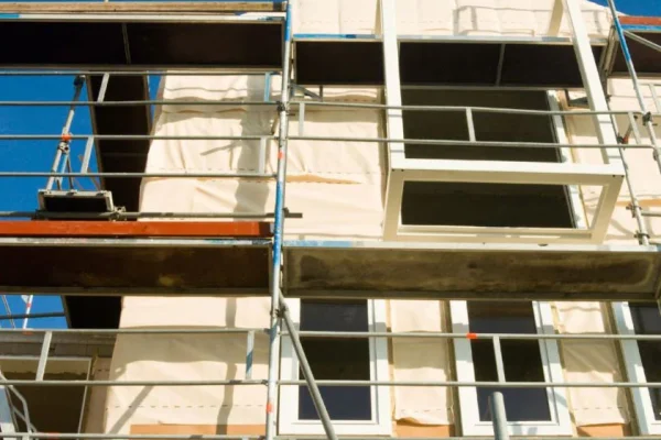 Window installation supported by Modesto Scaffolding Rental scaffold systems.